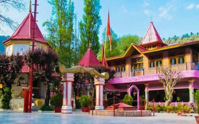 Colorful temple complex dedicated to Goddess Naina Devi on a sunny day